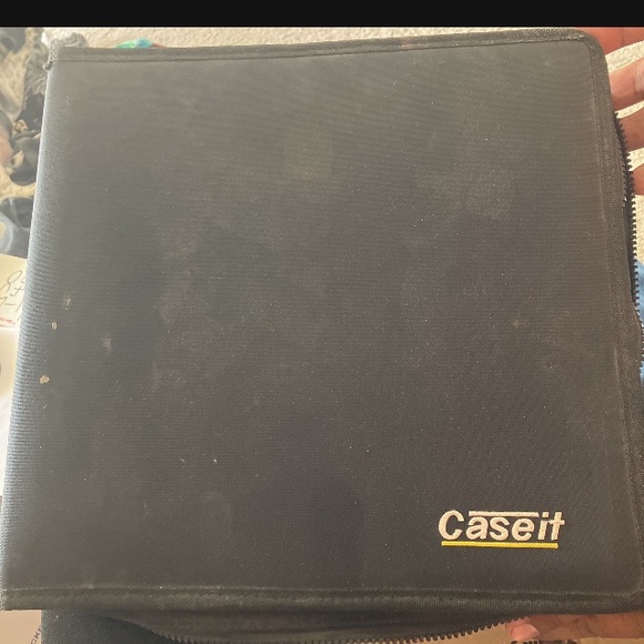 Mixture of around 50 DVDs and cds in soft cover book